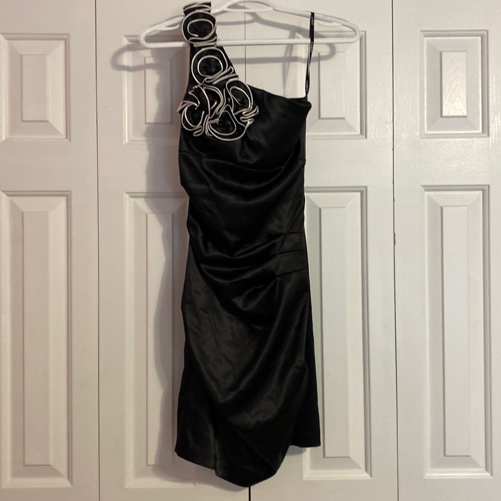 Black one shoulder cocktail dress with flower detail